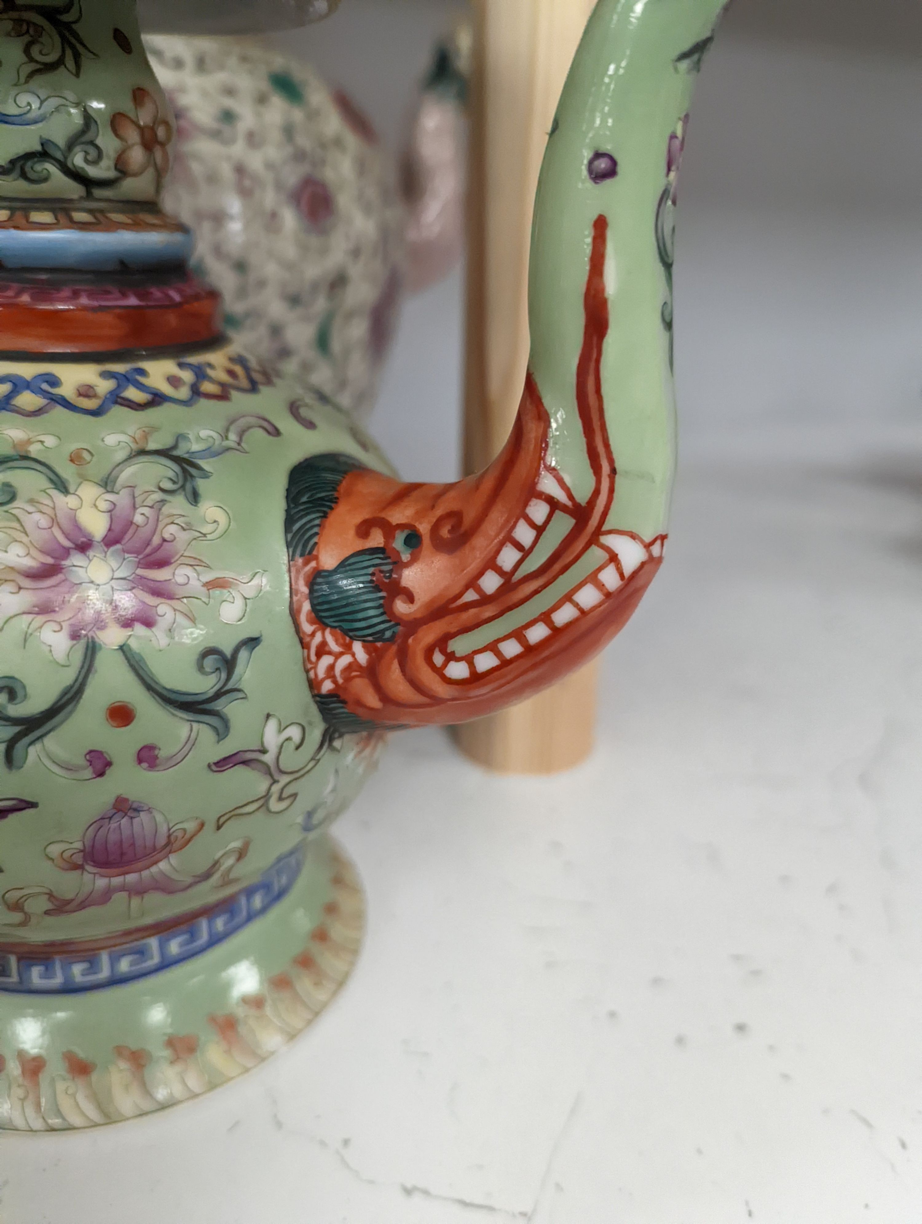 A large 19th century Chinese famille rose wine pot, and another wine pot, tallest 27cm